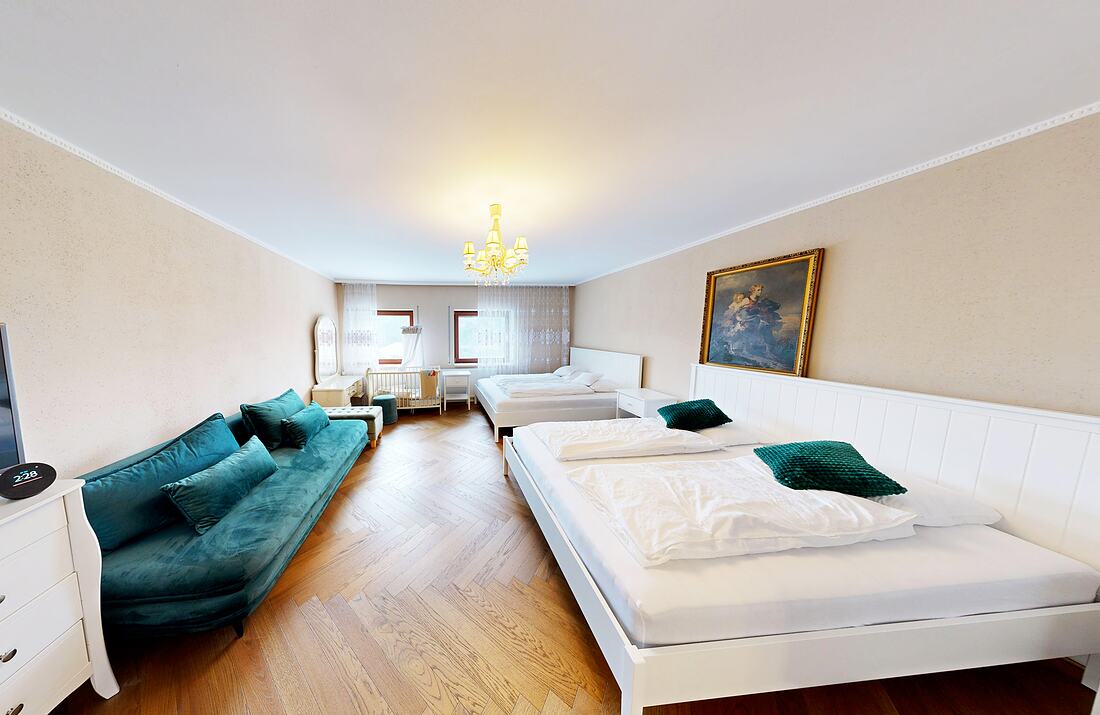 Room 1, the family suite — two beds and a sofa.